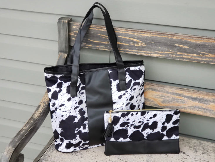 Black  cow hide print bag and zipper cosmetic bag